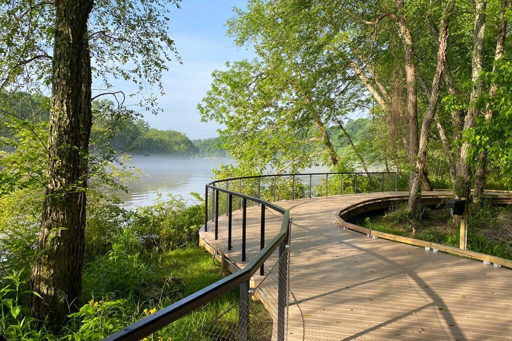 A wooden boardwalk winds along the Chattahoochee River