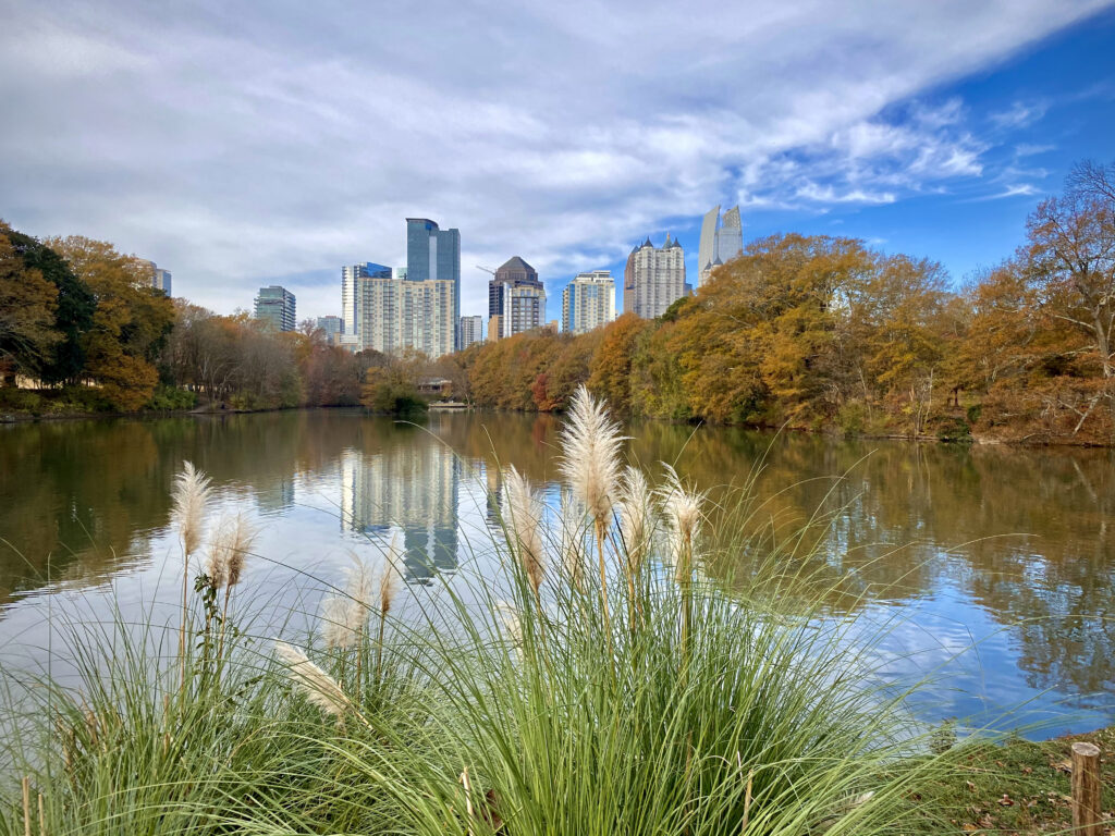 Lake Clara Meer and Midtown Atlanta skyline at Piedmont Park. The skyline is reflected on the water